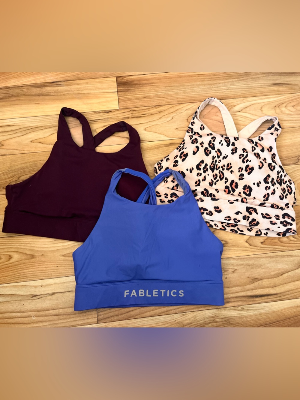 MEDIUM. Fabletics Blue, Burgundy & Cream Leopard Sports Bra Trio